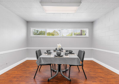 A room with a dining table at University Post Acute