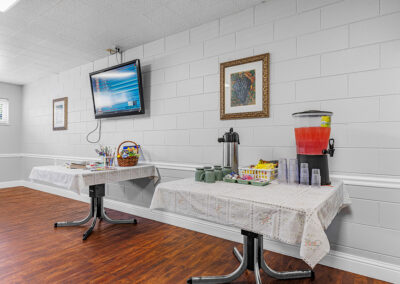 A common room with drinks on tables at University Post Acute