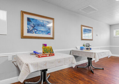 An activity room with games on tables at University Post Acute
